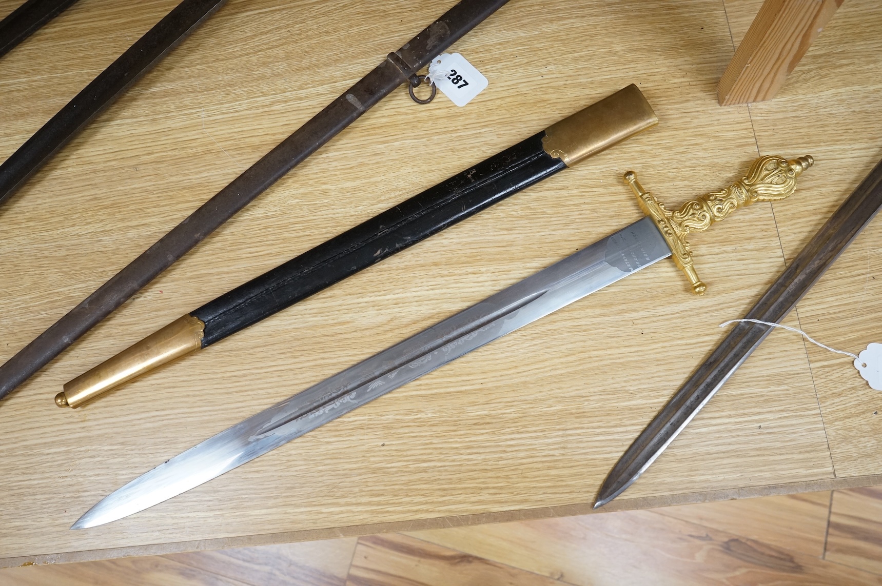 A Scottish sidearm for the King’s Own Bodyguard for Scotland, straight blade by J. Stewart and Son, etched and polished regulation blade, ormolu hilt, in its leather scabbard with ormolu mounts (gilding worn to mounts)